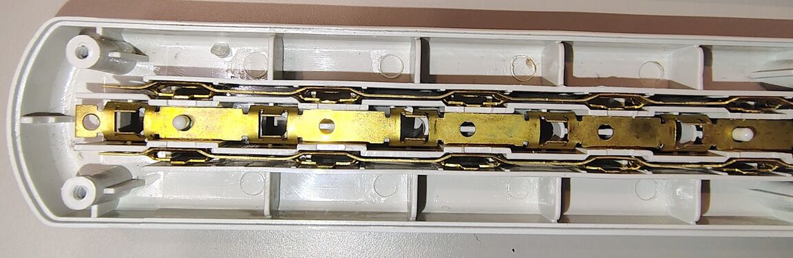 Outlet-end bus bars and outlet-contact assemblies.