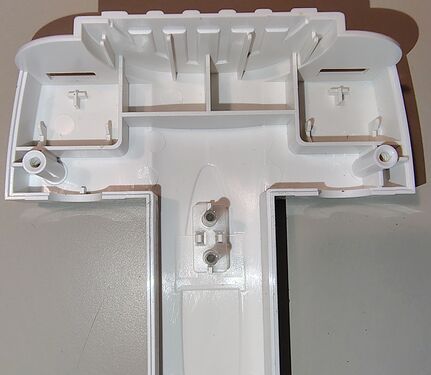 Upper housing showing support structures for the rotating outlet assemblies.