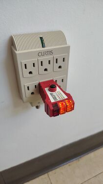 Outlet tester indicating correct wiring and grounding.