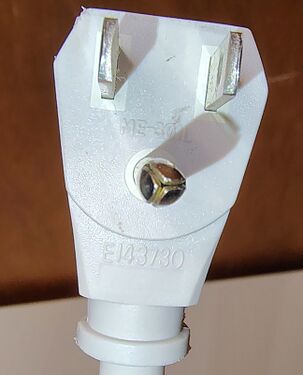 Grounding plug with molded approval markings.