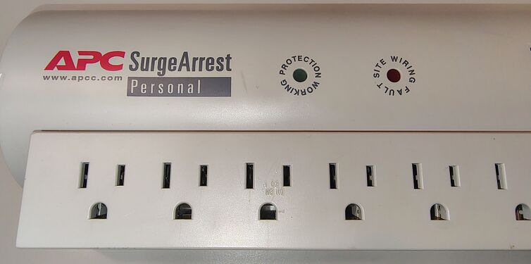 SurgeArrest Personal branding with Protection Working and Site Wiring Fault indicators.