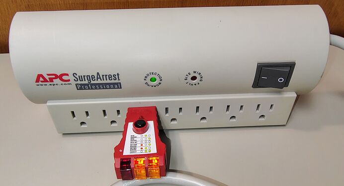 Outlet tester indicating correct wiring and grounding.
