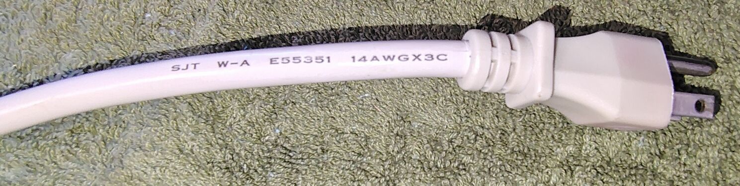 Attachment plug and cord markings showing SJT construction and 14 AWG conductors.