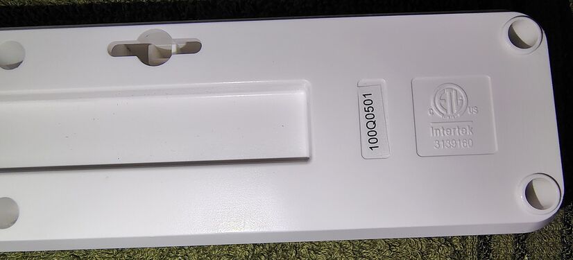 USB-port-end underside showing certification markings and inventory sticker.