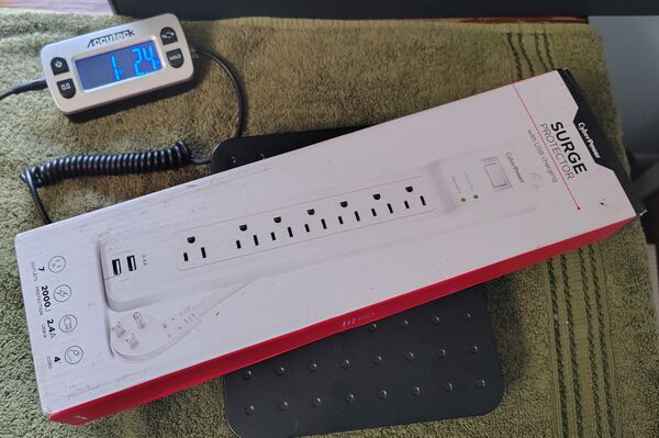 CyberPower P704URC1 and retail package on a digital scale.
