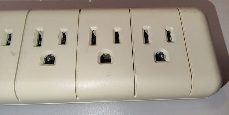 Outlet detail near the end of the surge protector.