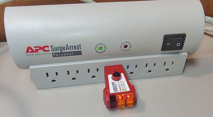 Outlet tester indicating correct wiring and grounding.