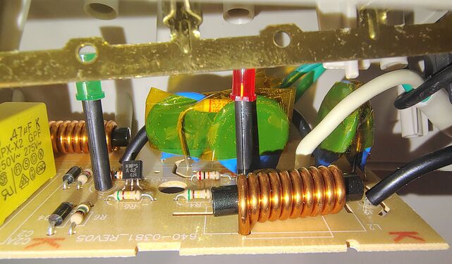Dual filtering inductors, MOV surge suppressors, X2-rated capacitor, and associated suppression circuitry.
