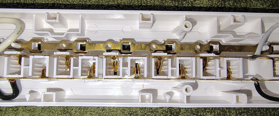 Center section showing bus bars and outlet contacts.