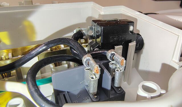 Switch and circuit-breaker assembly showing wiring terminations and internal power-distribution connections.