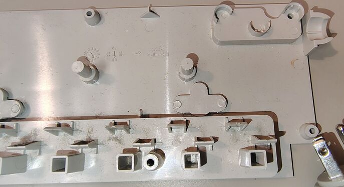 Upper-housing cord-entry area showing molded support features, mounting bosses, and outlet barriers.