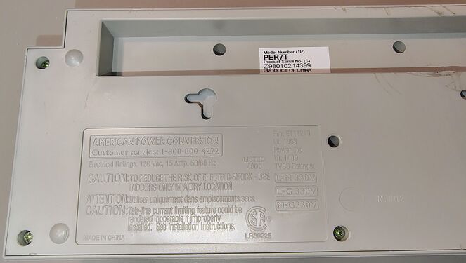 Molded regulatory-information panel showing electrical ratings, UL listings, and TVSS voltage ratings.