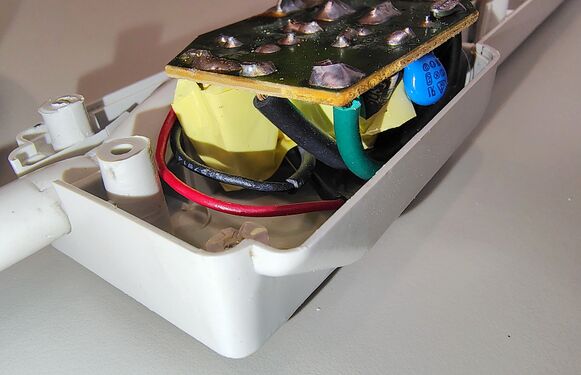 Surge-suppression circuit board and cord-entry wiring.