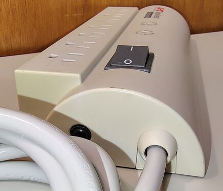 Cord-entry end showing the strain-relief assembly, rocker switch, and attached power cord.