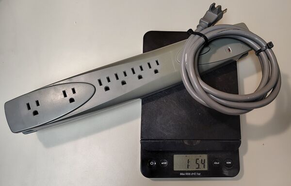Documented PowerSentry Model 626 weighing approximately 1 pound 5.4 ounces (607 grams).