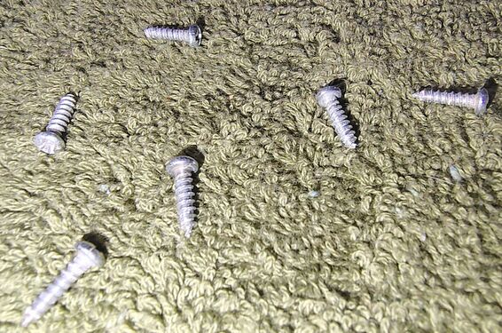 Six enclosure screws removed prior to disassembly.