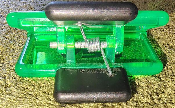 Internal spring and pivot mechanism.