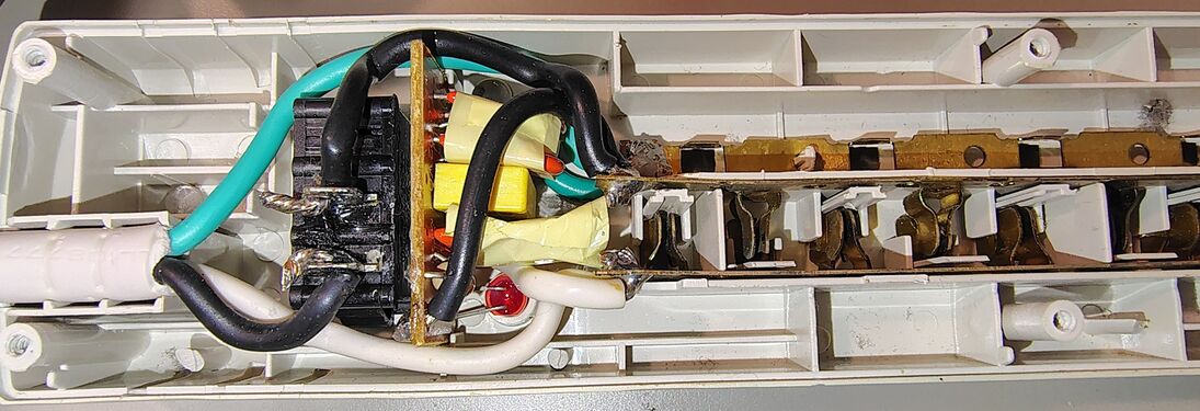Cord-entry end showing wiring and suppression circuitry.